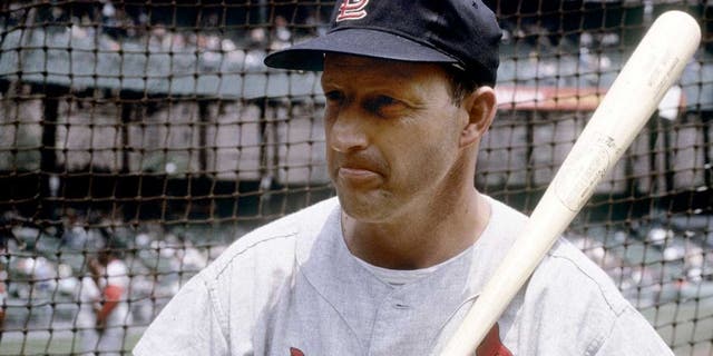 CIRCA 1960's: Outfielder/First Baseman Stan Musial of the St. Louis Cardinals with bat on shoulder infront of the batting cage before an early circa 1960's Major League Baseball game. sMusial played for the Cardinals from 1941-63. (Photo by Focus on Sport/Getty Images)