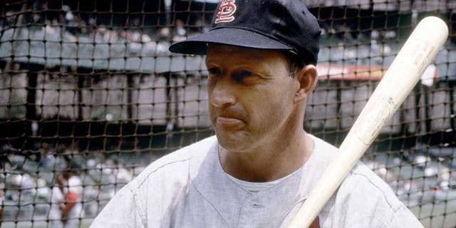 CIRCA 1960's: Outfielder/First Baseman Stan Musial of the St. Louis Cardinals with bat on shoulder infront of the batting cage before an early circa 1960's Major League Baseball game. sMusial played for the Cardinals from 1941-63. (Photo by Focus on Sport/Getty Images)