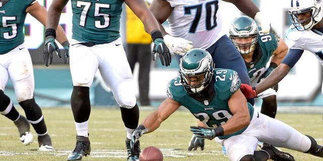 Nov 23, 2014; Philadelphia, PA, USA; Philadelphia Eagles strong safety Nate Allen (29) recovers a fumble during third quarter against the Tennessee Titans at Lincoln Financial Field. The Eagles defeated the Titans, 43-24. Mandatory Credit: Eric Hartline-USA TODAY Sports