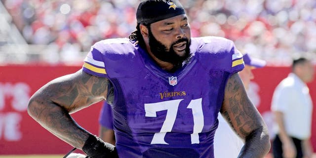 Oct 26, 2014; Tampa, FL, USA; Minnesota Vikings tackle Phil Loadholt (71) walks on the sidelines against the Tampa Bay Buccaneers at Raymond James Stadium. Mandatory Credit: David Manning-USA TODAY Sports