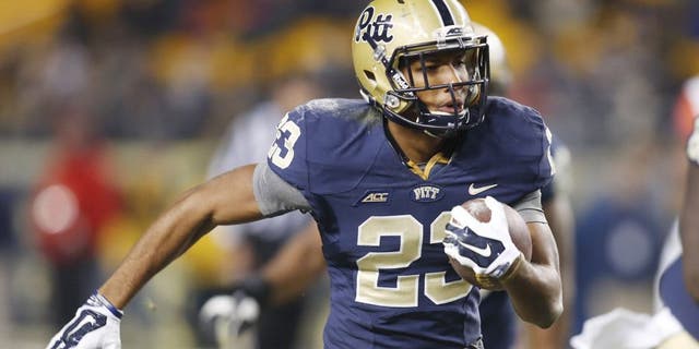 Nov 22, 2014; Pittsburgh, PA, USA; Pittsburgh Panthers wide receiver Tyler Boyd (23) runs on a forty-nine yard touchdown reception against the Syracuse Orange during the fourth quarter at Heinz Field. Pittsburgh won 30-7. Mandatory Credit: Charles LeClaire-USA TODAY Sports