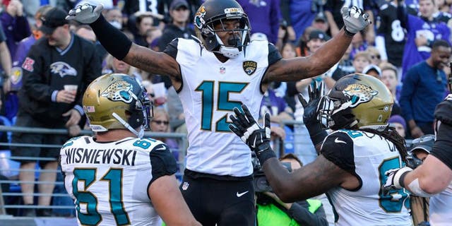 Nov 15, 2015; Baltimore, MD, USA; Jacksonville Jaguars wide receiver Allen Robinson (15) celebrates with teammates after catching a touchdown pass during the fourth quarter against the Baltimore Ravens at M&T Bank Stadium. Mandatory Credit: Tommy Gilligan-USA TODAY Sports