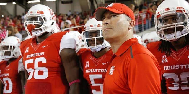 HOUSTON, TX - OCTOBER 17: Head coach of the Houston Cougars Tony Levine waits with his team prior to the start of their game against the Temple Owls at TDECU Stadium on October 17, 2014 in Houston, Texas. (Photo by Scott Halleran/Getty Images)