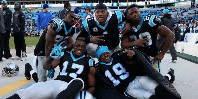 CHARLOTTE, NC - NOVEMBER 22: Teammates Jerricho Cotchery #82, Devin Funchess #17, Ted Ginn #19, Jonathan Stewart #28 and Cam Newton #1 of the Carolina Panthers celebrate after defeating the Washington Redskins 44-16 at Bank of America Stadium on November 22, 2015 in Charlotte, North Carolina. (Photo by Streeter Lecka/Getty Images)