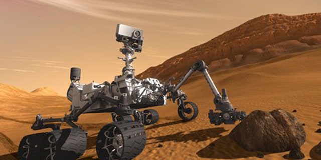 In this 2011 artist's rendering provided by NASA/JPL-Caltech, the Mars Science Laboratory Curiosity rover examines a rock on Mars with a set of tools at the end of its arm, which extends about 7 feet.