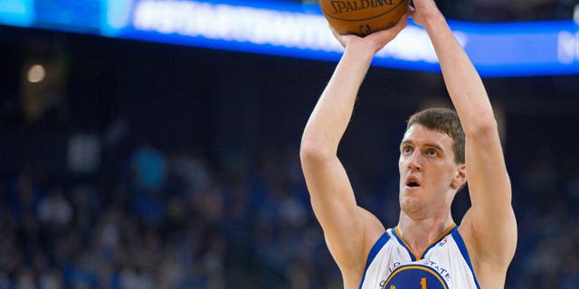 Oct 30, 2013; Oakland, CA, USA; Golden State Warriors center Ognjen Kuzmic (1) shoots a free throw against the Los Angeles Lakers during the fourth quarter at Oracle Arena. The Golden State Warriors defeated the Los Angeles Lakers 125-94. Mandatory Credit: Kelley L Cox-USA TODAY Sports