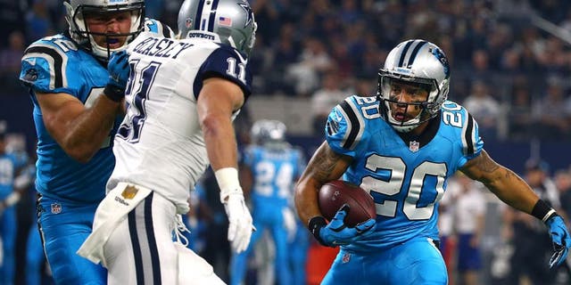ARLINGTON, TX - NOVEMBER 26: Kurt Coleman #20 of the Carolina Panthers returns an interception for a touchdown against Cole Beasley #11 of the Dallas Cowboys in the first quarter at AT&T Stadium on November 26, 2015 in Arlington, Texas. (Photo by Tom Pennington/Getty Images)