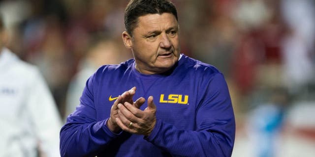 Nov 12, 2016; Fayetteville, AR, USA; LSU Tigers head coach Ed Orgeron walks onto the field to watch his players warmup before the game against the Arkansas Razorbacks at Donald W. Reynolds Razorback Stadium. Mandatory Credit: Brett Rojo-USA TODAY Sports