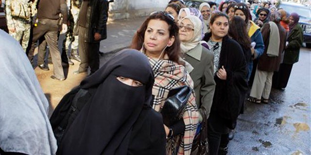November 28, 2011: Egyptian women line up out side a polling center in Cairo, Egypt.