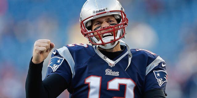 FOXBORO, MA - NOVEMBER 3: Tom Brady #12 of the New England Patriots reacts to the cheers of fans as he runs onto the field before a game with the Pittsburgh Steelers at Gillette Stadium on November 3, 2013 in Foxboro, Massachusetts. (Photo by Jim Rogash/Getty Images)