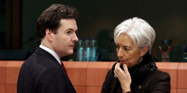 Nov. 28: French Finance Minister Christine Lagarde, right, shares a word with British Chancellor of the Exchequer George Osborne during a round table of eurozone finance ministers at the EU Council building in Brussels.