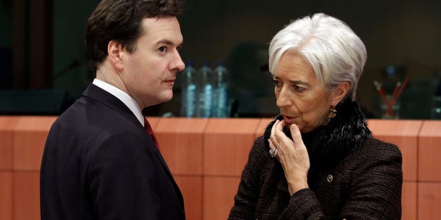 Nov. 28: French Finance Minister Christine Lagarde, right, shares a word with British Chancellor of the Exchequer George Osborne during a round table of eurozone finance ministers at the EU Council building in Brussels.