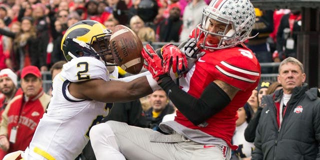 Nov 29, 2014; Columbus, OH, USA; Michigan Wolverines defensive back Blake Countess (2) breaks up a pass intended for Ohio State Buckeyes wide receiver Devin Smith (9) at Ohio Stadium. Mandatory Credit: Greg Bartram-USA TODAY Sports