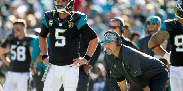 Nov 29, 2015; Jacksonville, FL, USA; Jacksonville Jaguars quarterback Blake Bortles (5) and head coach Gus Bradley look on during the third quarter against the San Diego Chargers at EverBank Field. The San Diego Chargers won 31-25. Mandatory Credit: Logan Bowles-USA TODAY Sports