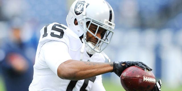 Nov 29, 2015; Nashville, TN, USA; Oakland Raiders receiver Michael Crabtree (15) catches the ball prior to the game against the Tennessee Titans at Nissan Stadium. Mandatory Credit: Christopher Hanewinckel-USA TODAY Sports