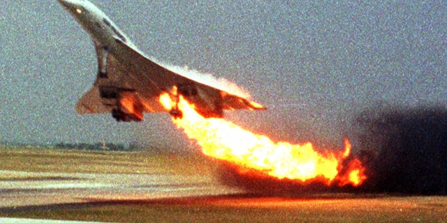 FILE - In this July 25, 2000, file photo, Air France Concorde flight 4590 takes off with fire trailing from its engine on the left wing from Charles de Gaulle airport in Paris.