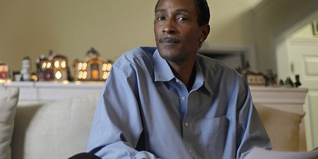Nov. 30: Wayne Pittman, 46, sits in his Lawrenceville, Ga., home looking over unemployment papers as his extended benefits are set to expire unless Congress passes a vote to extend them.