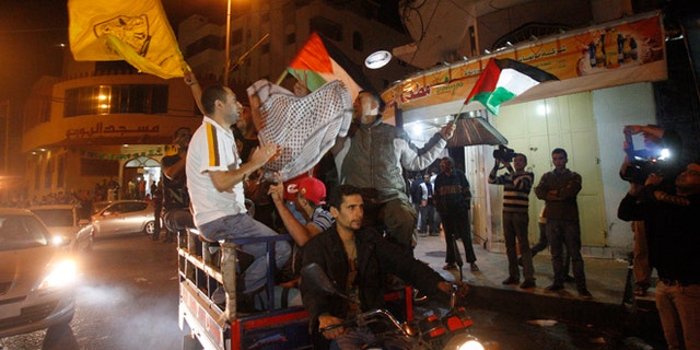 Nov. 21, 2012: Palestinians celebrate the cease-fire agreement between Israel and Hamas in Gaza City.