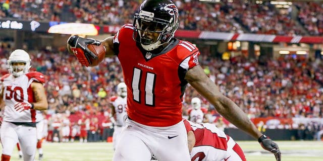 ATLANTA, GA - NOVEMBER 30: Julio Jones #11 of the Atlanta Falcons catches a pass during the first half against the Arizona Cardinals at the Georgia Dome on November 30, 2014 in Atlanta, Georgia. (Photo by Kevin C. Cox/Getty Images)