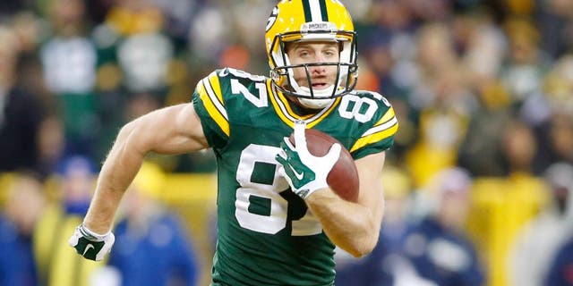 Nov 30, 2014; Green Bay, WI, USA; Green Bay Packers wide receiver Jordy Nelson (87) catches a touchdown pass during the first half against the New England Patriots at Lambeau Field. Mandatory Credit: Chris Humphreys-USA TODAY Sports