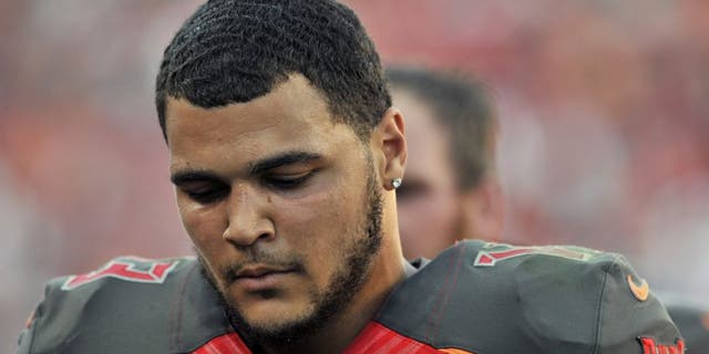 Tampa Bay Buccaneers wide receiver Mike Evans (13) leaves the field following the team's 14-13 loss to the Cincinnati Bengals during an NFL football game Sunday, Nov. 30, 2014, in Tampa, Fla. (AP Photo/Steve Nesius)