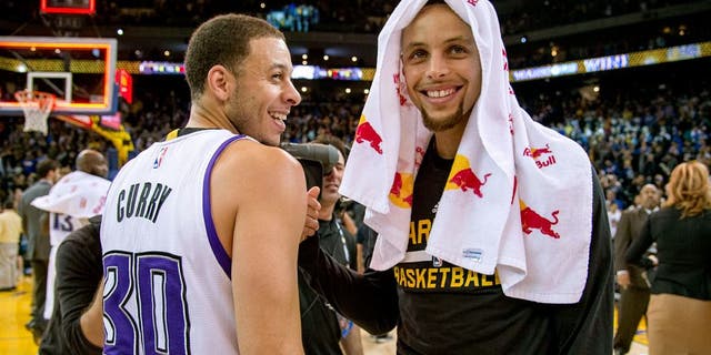 November 28, 2015; Oakland, CA, USA; Sacramento Kings guard Seth Curry (30, left) smiles while talking with Golden State Warriors guard Stephen Curry (30, right) after the game at Oracle Arena. The Warriors defeated the Kings 120-101. Mandatory Credit: Kyle Terada-USA TODAY Sports