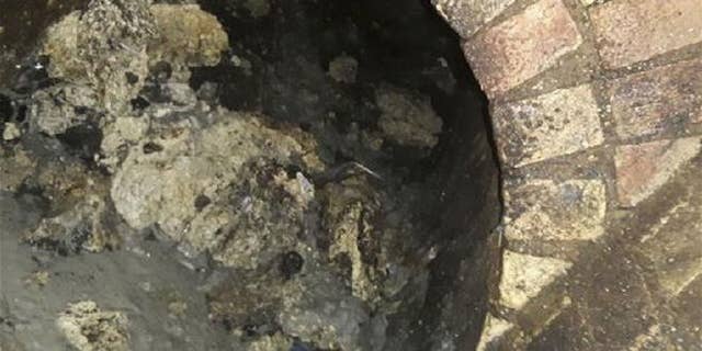 In this undated handout photo issued by Thames Water on Sept. 12, 2017, a view of part of a fatberg is seen inside a sewer in Whitechapel, London.