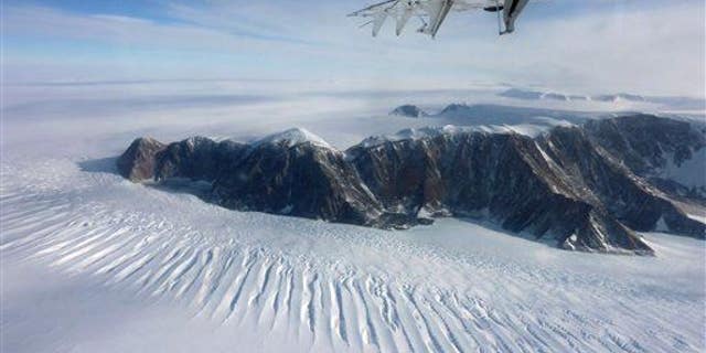 In this photo taken on Nov. 25, 2011, a plane flies over the Transantarctic Mountains.