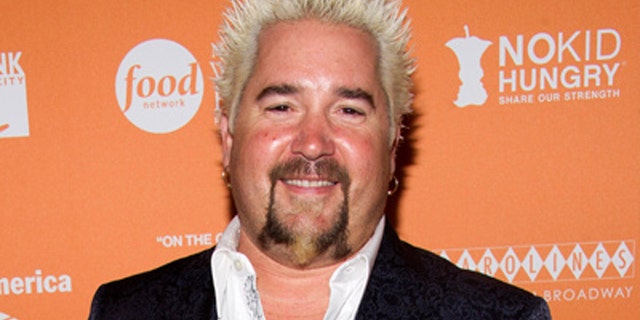 We no longer have to image what Guy Fieri looks without his signature frosted spikes.
