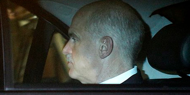 November 9, 2011: Greek Prime Minister George Papandreou travels by car as he leaves the presidential palace after a meeting with Greek President Karolos Papoulias and various other political leaders in Athens.