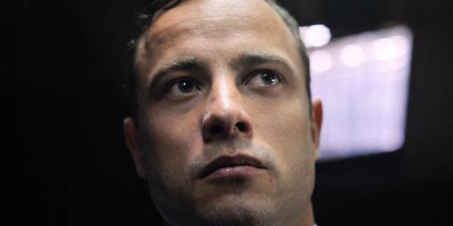 South African Paralympic sprinter Oscar Pistorius stands in the Magistrate Court in Pretoria on June 4, 2013