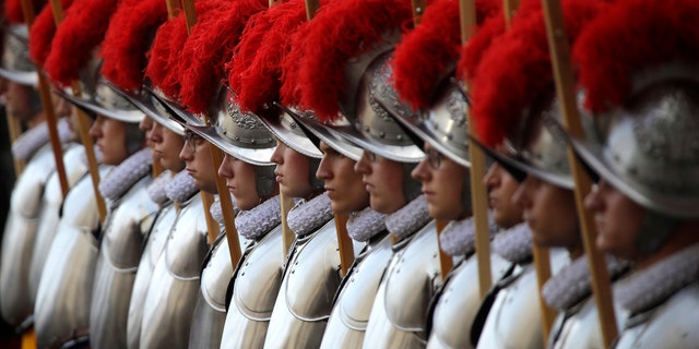 Swiss Guard recruits stand at attention during the swearing-in ceremony at the Vatican on May 6, 2018.