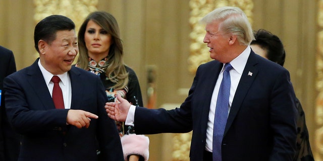 U.S. President Donald Trump and China's President Xi Jinping arrive at a state dinner at the Great Hall of the People in Beijing, China, November 9, 2017. 