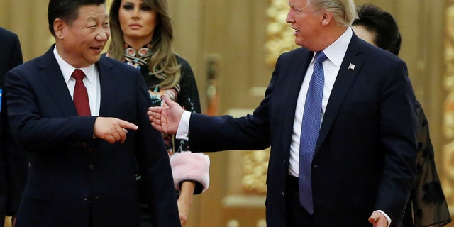 U.S. President Donald Trump and China's President Xi Jinping arrive at a state dinner at the Great Hall of the People in Beijing, China, November 9, 2017. 