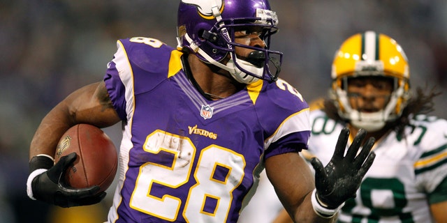 Dec. 30, 2012: Minnesota Vikings running back Adrian Peterson, left, runs from Green Bay Packers cornerback Tramon Williams during the first half of an NFL football game in Minneapolis.