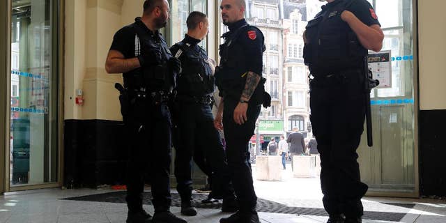 French police patrol the railway station in Lille, France, Tuesday, June 14, 2016, where Russia will play the Euro 2016 match against Slovakia. Russia coach Leonid Slutsky expects his team's fans to behave themselves in Wednesday's game against Slovakia and avoid his side being expelled from the European Championship. (AP Photo/Darko Bandic)