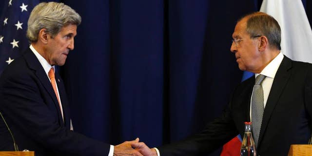 In this Sept. 9, 2016, photo, U.S. Secretary of State John Kerry, left, and Russian Foreign Minister Sergei Lavrov shakes hands at the conclusion of a news conference following their meeting to discuss the crisis in Syria, in Geneva, Switzerland. The deal crafted by the U.S. and Russia to halt the Syrian civil war and focus efforts on rooting out extremists in the country is rife with legal and liability questions that are fueling Pentagon skepticism about military cooperation between the two powers, senior U.S. officials said. (Kevin Lamarque/Pool Photo via AP)