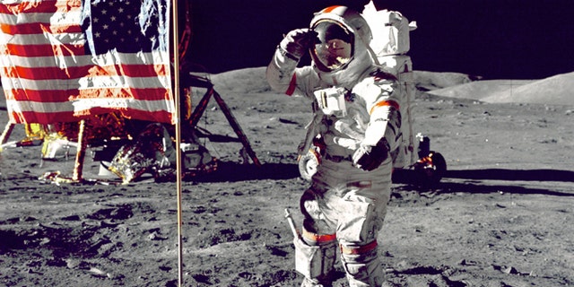 Eugene Cernan salutes the American flag during the Apollo 17 mission in 1972.