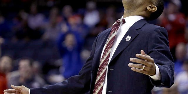 Stanford head coach Johnny Dawkins reacts to play against Dayton during the first half in a regional semifinal game at the NCAA college basketball tournament, Thursday, March 27, 2014, in Memphis, Tenn. (AP Photo/Mark Humphrey)