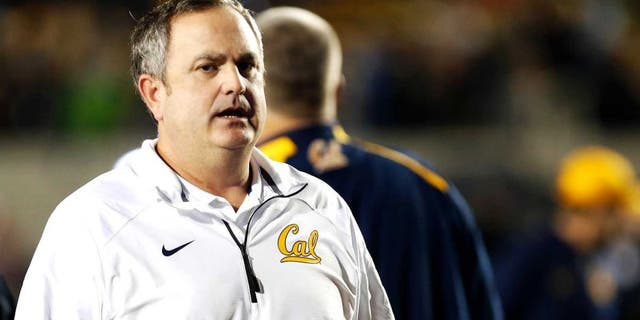 Nov 29, 2014; Berkeley, CA, USA; California Golden Bears head coach Sonny Dykes leaves the field after the loss against the Brigham Young Cougars at Memorial Stadium. The Brigham Young Cougars defeated the California Golden Bears 42-35. Mandatory Credit: Kelley L Cox-USA TODAY Sports