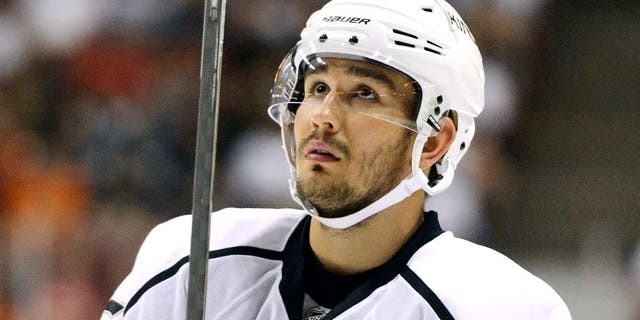 Sep 28, 2014; Anaheim, CA, USA; Los Angeles Kings defender Slava Voynov (26) looks up during a break in play against the Anaheim Ducks during the third period at Honda Center.