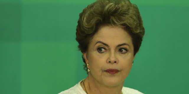 Dec. 2, 2015: Brazil's President Dilma Rousseff arrives at a press conference after impeachment proceedings were opened against her by the President of Chamber of Deputies Eduardo Cunha, at the Planalto Presidential Palace in Brasilia, Brazil.