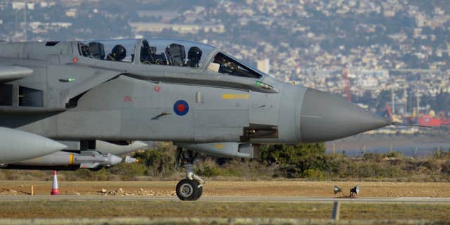 Dec. 3, 2015: A British tornado warplane passes on the runway at the RAF Akrotiri, a British air base near costal city of Limassol, Cyprus after an airstrike.