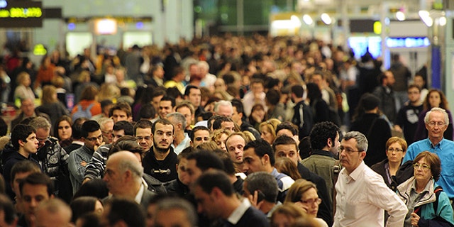 Dec. 3: Passengers wait for news about their flights at T1 terminal of El Prat Llobregat airport in El Prat Llobregat, near Barcelona.