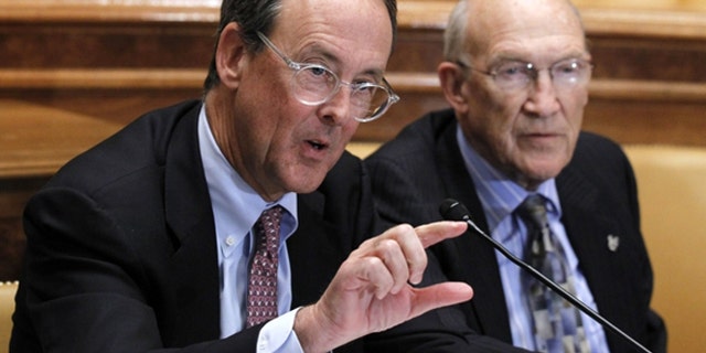 Nov. 10, 2010: Erskine Bowles, left, accompanied by former Wyoming Sen. Alan Simpson, co-chairmen of President Obama's bipartisan deficit commission, gestures while speaking on Capitol Hill in Washington.