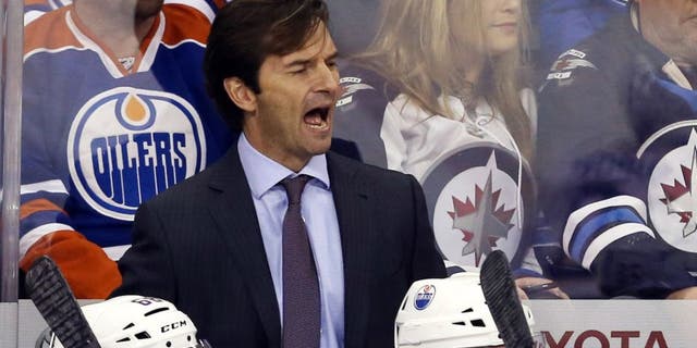 Dec 3, 2014; Winnipeg, Manitoba, CAN; Edmonton Oilers head coach Dallas Eakins reacts during the second period against the Winnipeg Jets at MTS Centre. Mandatory Credit: Bruce Fedyck-USA TODAY Sports