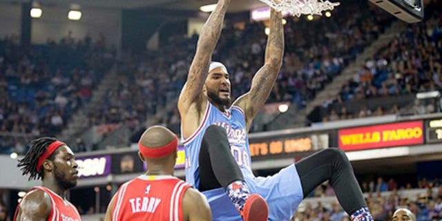 Nov 6, 2015; Sacramento, CA, USA; Sacramento Kings center Willie Cauley-Stein (00) reacts above Houston Rockets forward Montrezl Harrell (35), guard Jason Terry (31) and guard Marcus Thornton (10) after a dunk during the third quarter at Sleep Train Arena. The Houston Rockets defeated the Sacramento Kings 116-110. Mandatory Credit: Kelley L Cox-USA TODAY Sports