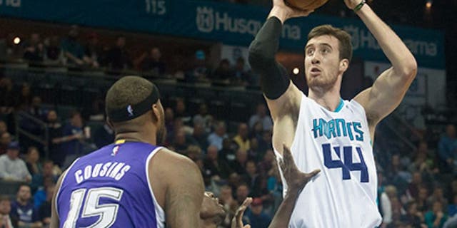 Nov 23, 2015; Charlotte, NC, USA; Charlotte Hornets center Frank Kaminsky III (44) goes up for a shot over Sacramento Kings guard Darren Collison (7) during the second half at Time Warner Cable Arena. The Hornets defeated the Kings 127-122 in OT. Mandatory Credit: Jeremy Brevard-USA TODAY Sports