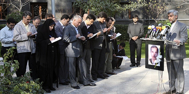 Dec. 4: Iran's top nuclear negotiator Saeed Jalili, right, speaks with media, during a press briefing, in Tehran, Iran.