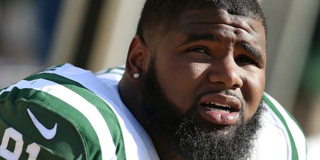 GREEN BAY, WI - SEPTEMBER 14: Defensive end Sheldon Richardson #91 of the New York Jets on the sidelines during the NFL game against the Green Bay Packers at Lambeau Field on September 14, 2014 in Green Bay, Wisconsin. The Packers defeated the Jets 31-24. (Photo by Christian Petersen/Getty Images) *** Local Caption *** Sheldon Richardson
